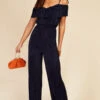 Little Mistress Navy Plisse Cold Shoulder Jumpsuit 2 Little Mistress Navy Plisse Cold Shoulder Jumpsuit -Occasion Couture Shop D3374261A 1